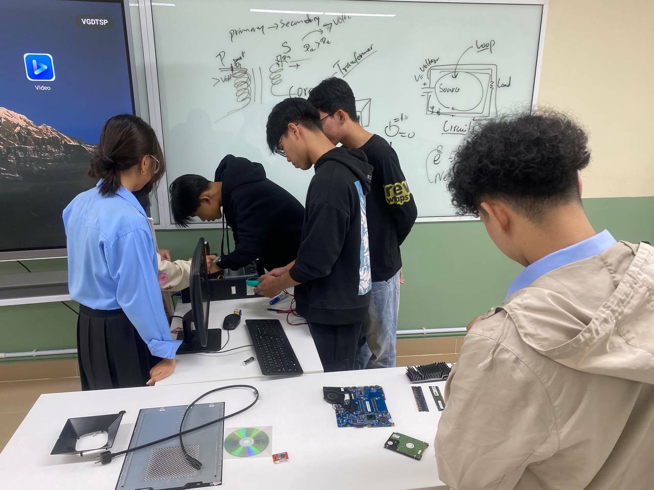 Students working on computer hardware